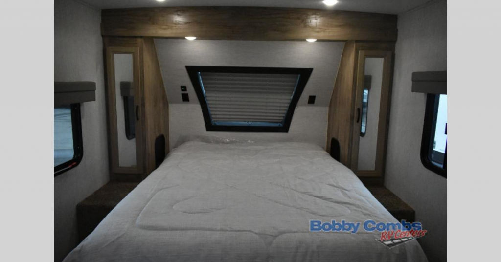 Bed in the Palomino Solaire travel trailer